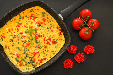 Traditional Delicious omelette with vegetables in frying pan, Copy space, Top view, Food Concept.