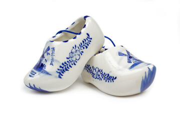 A handmade and hand-painted miniature of the Holland clogs. Porcelain. Isolated on white.