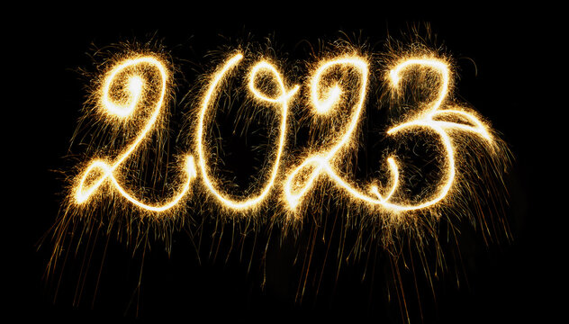Sparkling Year 2023 painted with sparkles. Written on a deep black background.