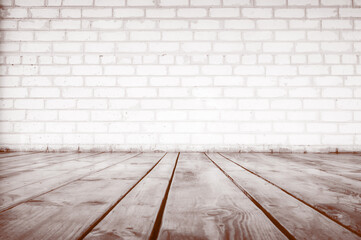 Brick wall and wood planks in old-style interior. Sepia toned