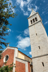Fototapeta na wymiar Bell Tower and Parish Church of Novigrad, Istria, Croatia