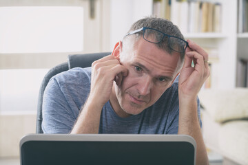 Tired and overworked freelancer at his working place