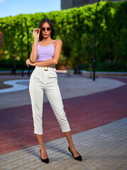 Portrait of young woman at outdoors.