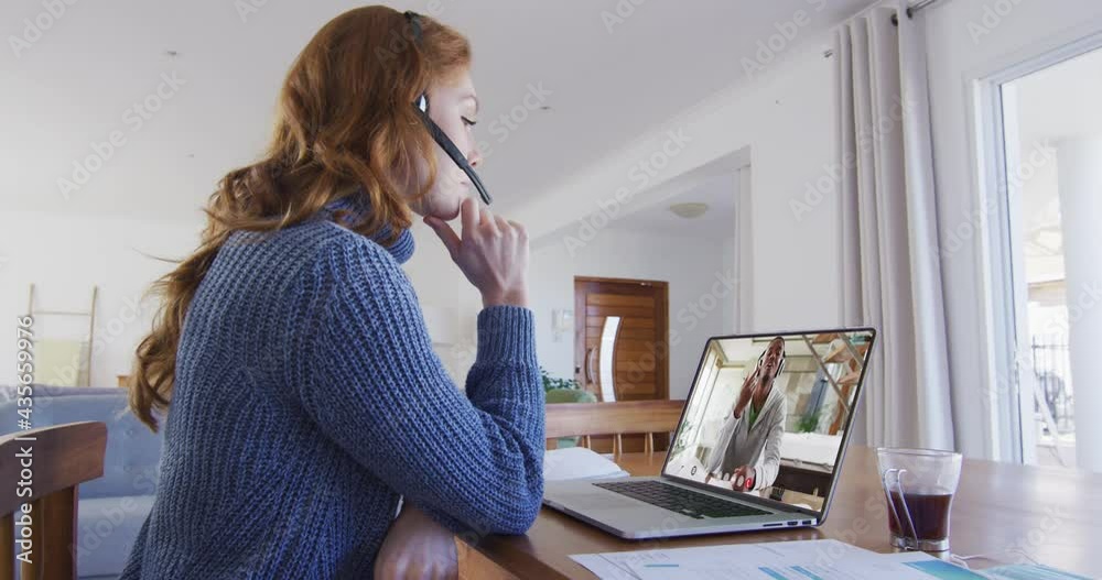 Poster Caucasian female teacher having a video call with male college student on laptop at home