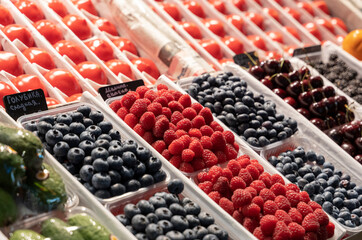 Fresh vegetables and fruits on the counter at the market place. Beautiful, delicious crop.