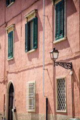 Fototapeta na wymiar Street lamps on the walls of Italian cities