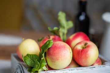 Ripe red apples in wooden box. Space for your text.