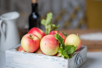 Ripe red apples in wooden box. Space for your text.