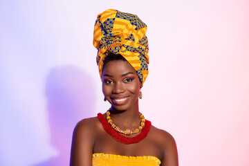 Photo of positive happy young dark skin woman smile face wear turban isolated on abstract light...