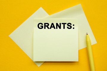 we are here to help. Yellow pen and stickers on a yellow background