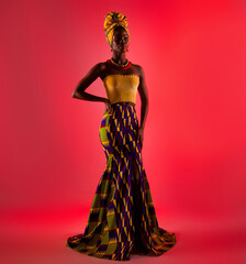 Full length photo of charming afro american woman look empty space wear tradition outfit isolated...