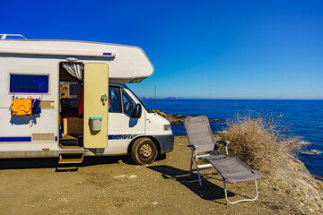 Camper rv on sea with clothes to dry