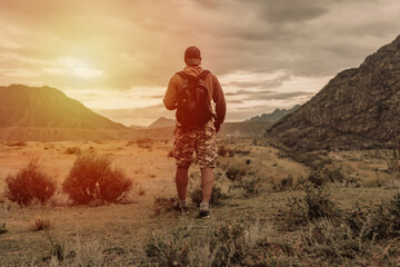 Naklejka premium one hiker men walking in the mountains