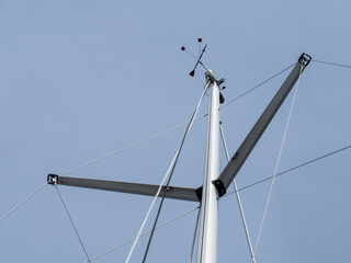 Close up view of the mast head of a sailboat mast showing the wind speed and wind direction...