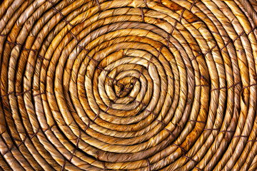 Spiral pattern of wicker basket bottom.