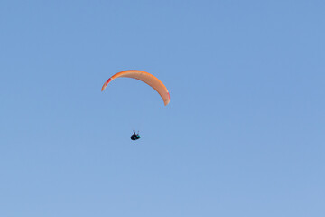A paraglider enjoys the cliff top views of the South Downs Way at Beachy Head thanks to the light winds.