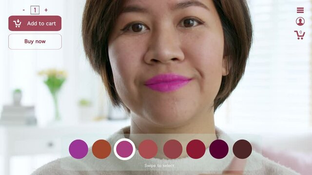 POV asia female woman relax happy smile enjoy home apply lips makeup on ai ar vr mixed augmented reality e-commerce future fashion mall app in iot smart touch web screen push buy select color button.