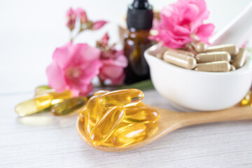 Alternative medicine herbal organic capsule with vitamin E omega 3 fish oil, mineral, drug with herbs leaf natural supplements for healthy good life.