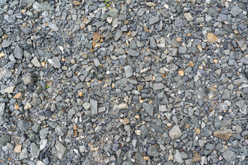 Stony soil texture from stones, gravel and split, gray background 