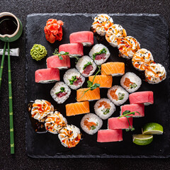 fresh and tasty sushi on the black background