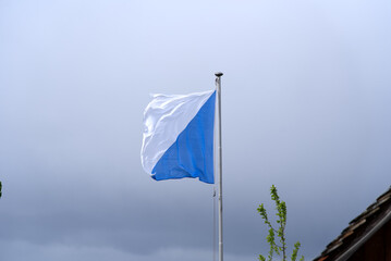 Flag of canton Zurich blowing in the wind. Photo taken May 25th, 2021, Zurich, Switzerland.