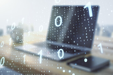Double exposure of creative abstract binary code hologram and modern desktop with laptop on background. Database and programming concept