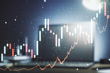 Multi exposure of abstract financial graph on laptop background, financial and trading concept