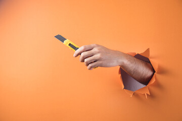 Hand holds cutter