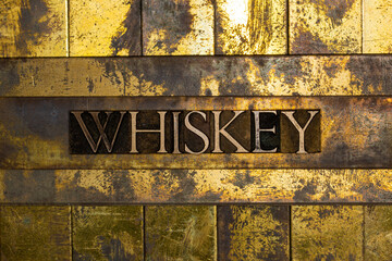 Whiskey text on textured copper and gold background