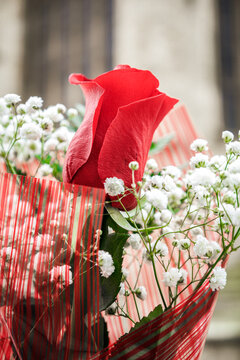 Close-up of a bousquet of flowers with a cathedral window in the background