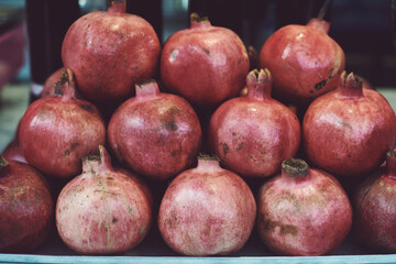 red pomegranates stacked up
