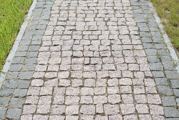 Granite pavement. Footpaths with granite cobblestones 
