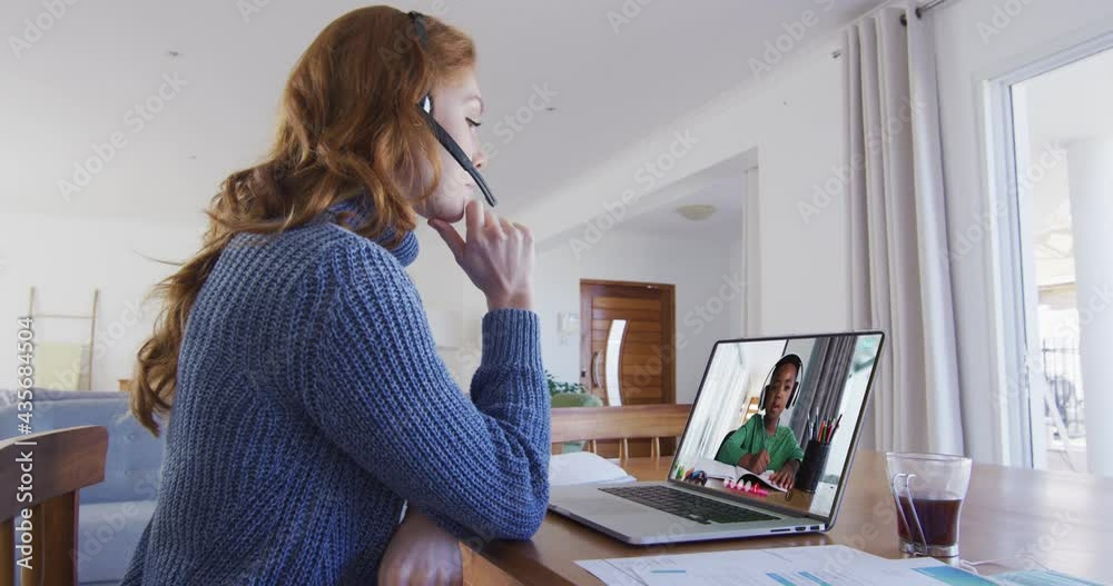 Poster Caucasian female teacher sitting at desk using laptop having online school lesson