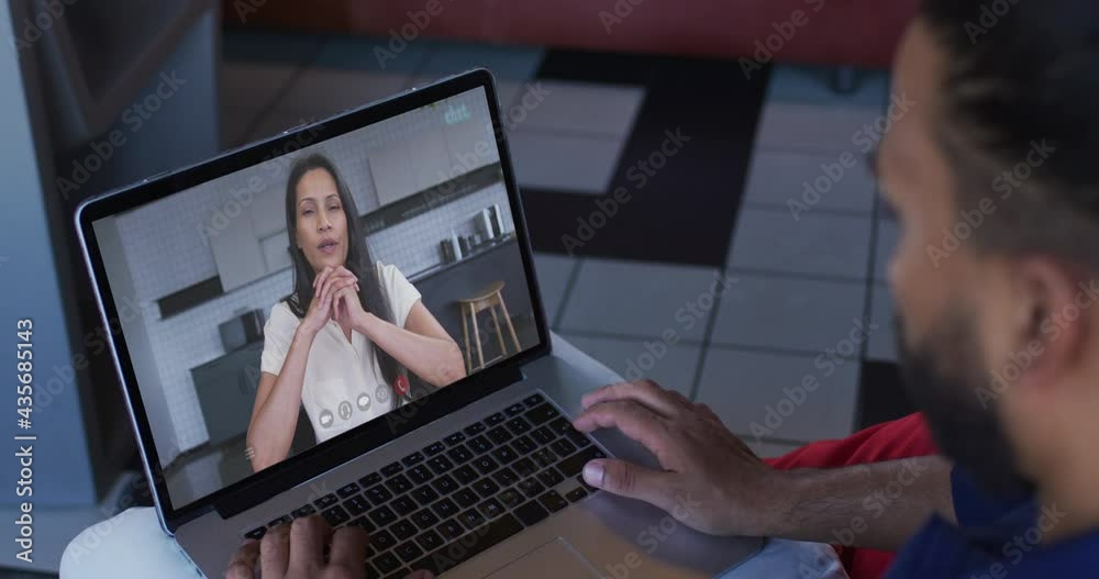 Poster Middle eastern man having a video call with female colleague on laptop