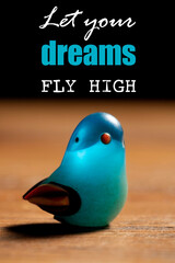 Inspirational motivation quote. Positive message says Let you dreams fly high. Selective focus