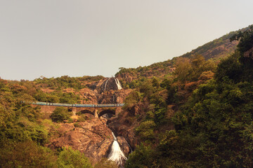 Beautiful morning view of the Dudhsagar Falls and railroad bridge in Goa/India