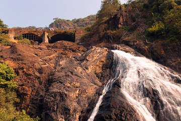 Beautiful morning view of the Dudhsagar Falls and railway bridge in Goa, India