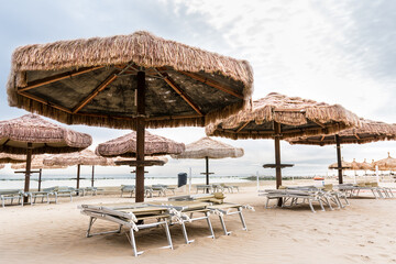 Palm umbrellas on the beach in Pescara (Abruzzo)