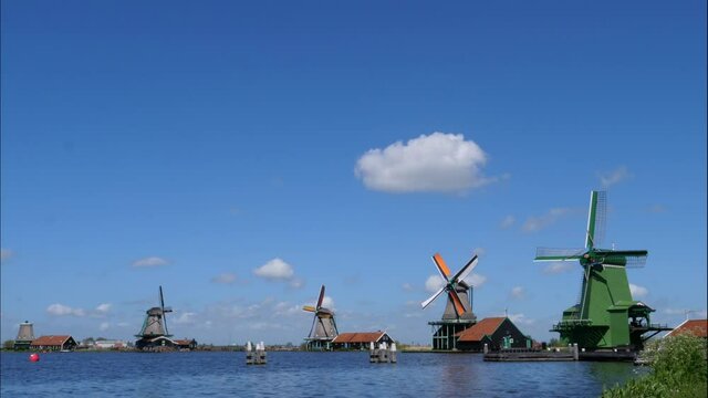 Windmills of Zaanse Schans in Dutch landscape, time lapse