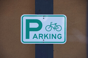 Green and white traffic sign for reserved bicycle parking