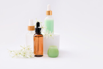 Plakat Natural cosmetic skincare bottle containers on light background. Natural beauty