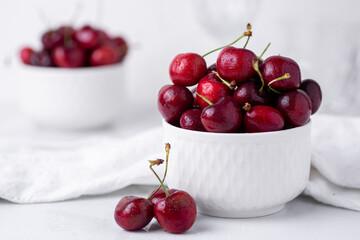Two small bowls of beautiful fresh ripe cherries