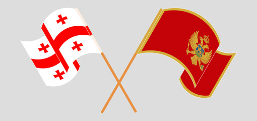 Crossed and waving flags of Georgia and Montenegro