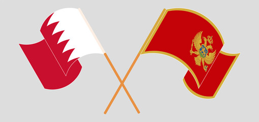 Crossed and waving flags of Bahrain and Montenegro