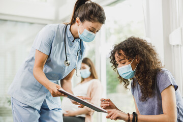 African American Girl Talking To Nurse Before Covid-19 Vaccine
