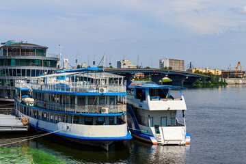 Fototapeta na wymiar Tourist ships in a river port in Kiev, Ukraine
