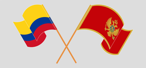 Crossed and waving flags of Colombia and Montenegro