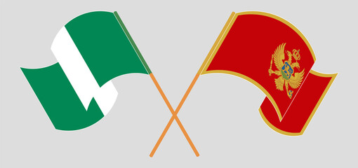 Crossed and waving flags of Nigeria and Montenegro