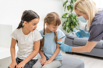 The doctor makes a child vaccination