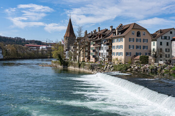 Bremgarten, small town in canton of Aargau in Switzerland with Hexenturm on sunny day. Reuss river with round medieval tower build 1415, called witch tower.